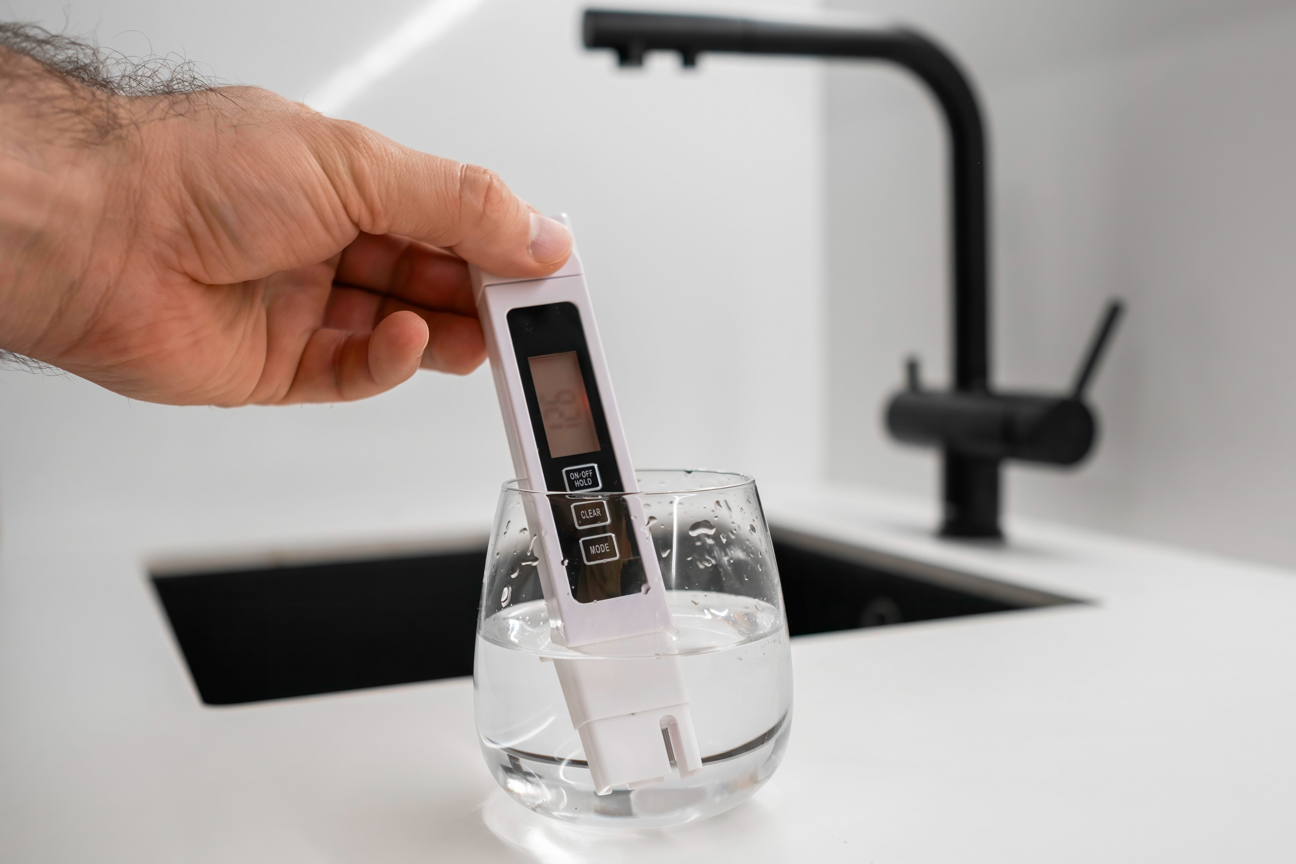 Digital TDS meter measuring total dissolved solids in tap water — Edmonton